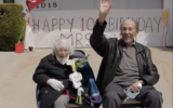 Marthe Cohn greets well-wishers during a car parade celebrating her 100th birthday, April 13, 2020. (Courtesy via JTA)